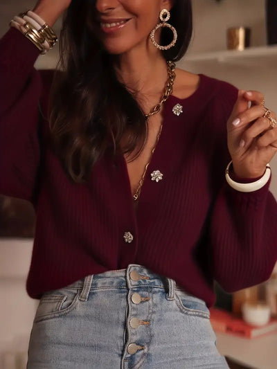 Gilet col rond tricoté avec bouton stylisé