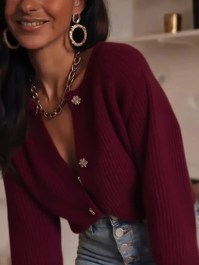 Gilet col rond tricoté avec bouton stylisé