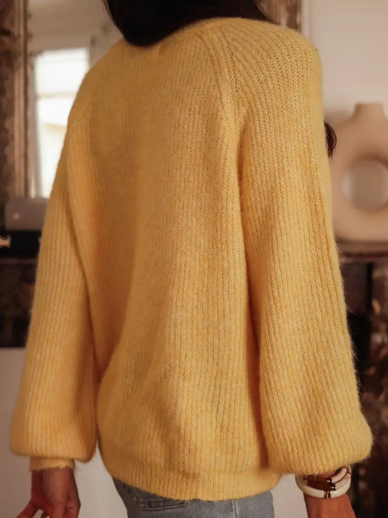 Gilet col rond tricoté avec bouton stylisé