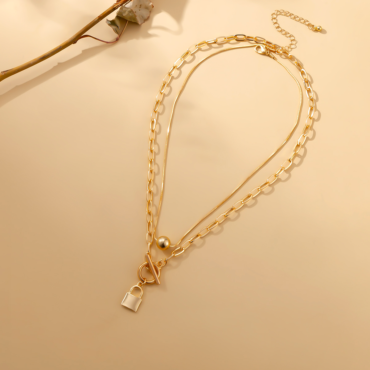 Collier double cadenas et perle