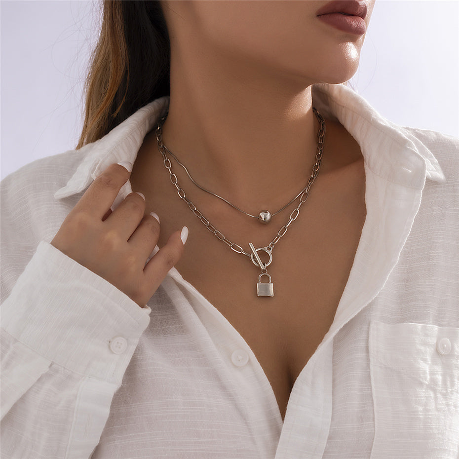 Collier double cadenas et perle