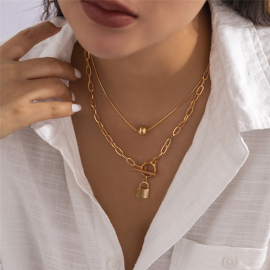 Collier double cadenas et perle